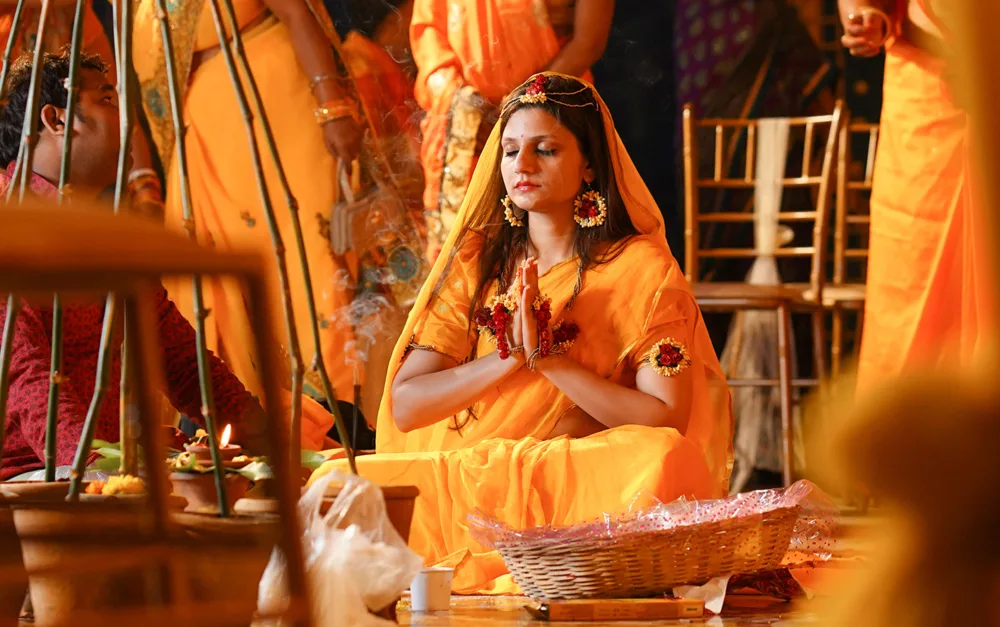 Bride in yellow during the haldi ceremony, traditional wedding photography Bangalore